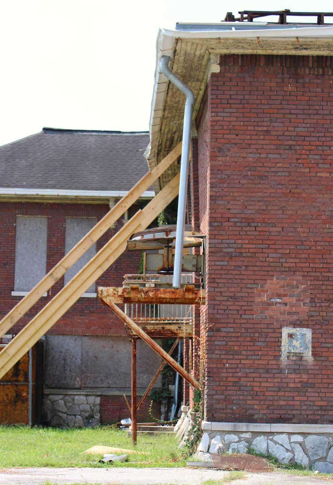 Current condition: historic brickwork and damaged roofline