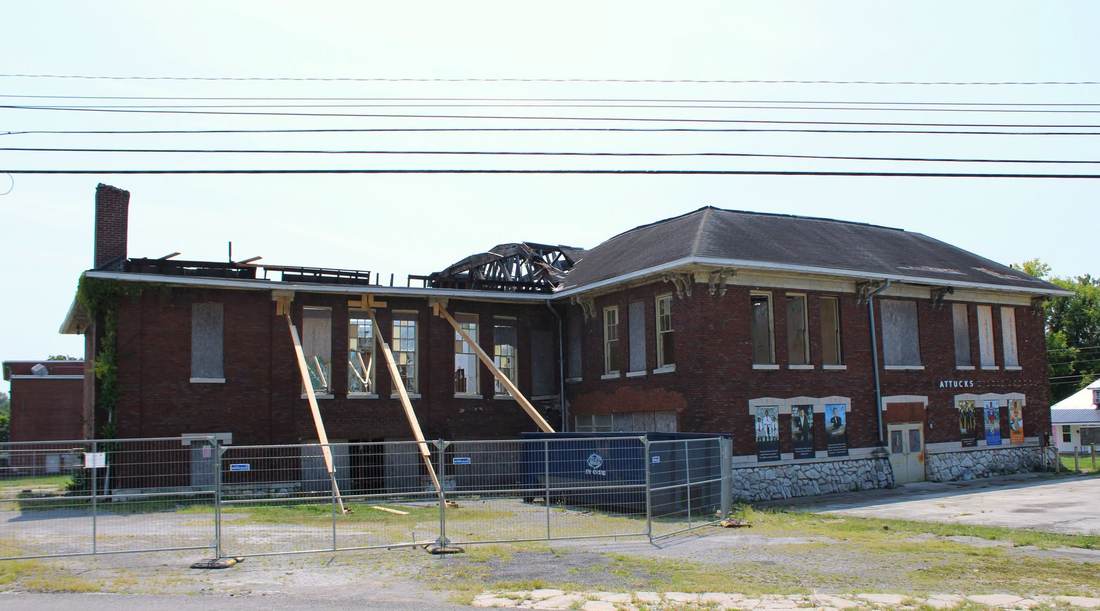 Current condition: wide view of Attucks and damaged roof